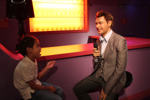 My son pretending to be one of the contestants of American Idol being interviewed by Ryan Seacrest