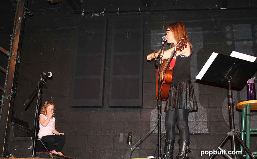 Lisa Loeb and daughter on stage at McCabe's Guitar Shop
