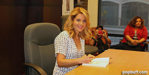 Candace Cameron Bure with her latest book Dancing Through Life