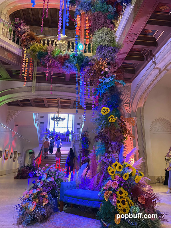 A towering floral installation in the museum rotunda of San Diego Art Museum designed by Beth O'Reilly