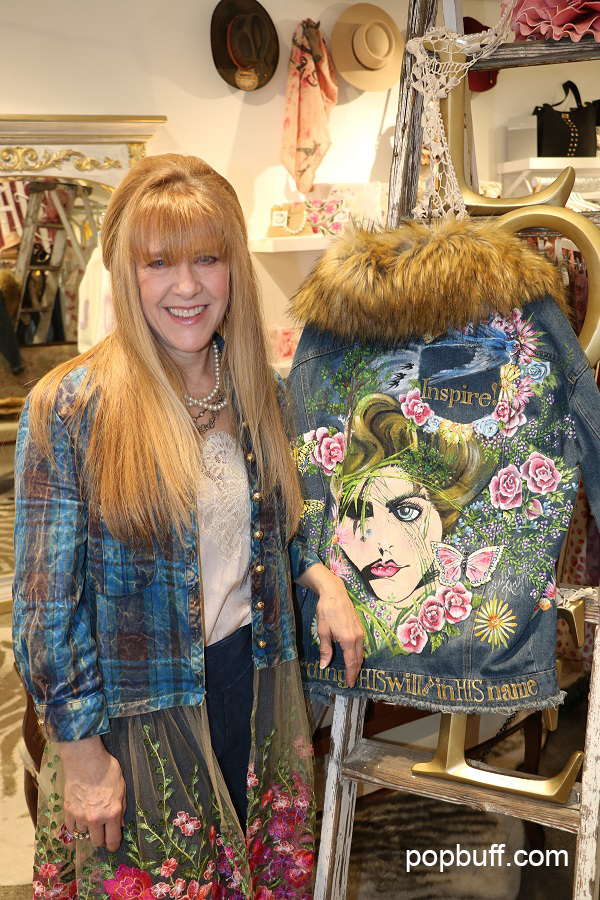 Owner Julie Mazza with one of her art pieces at Inspiration Boutique in San Juan Capistrano - Popbuff